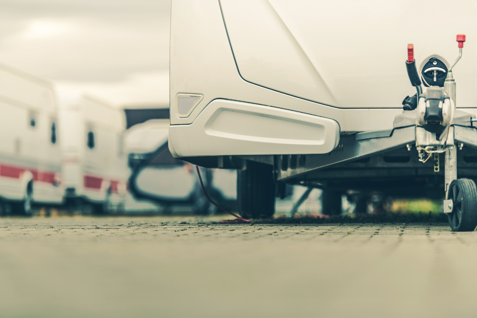 A closeup shot of a travel trailer with the hitch being the focus