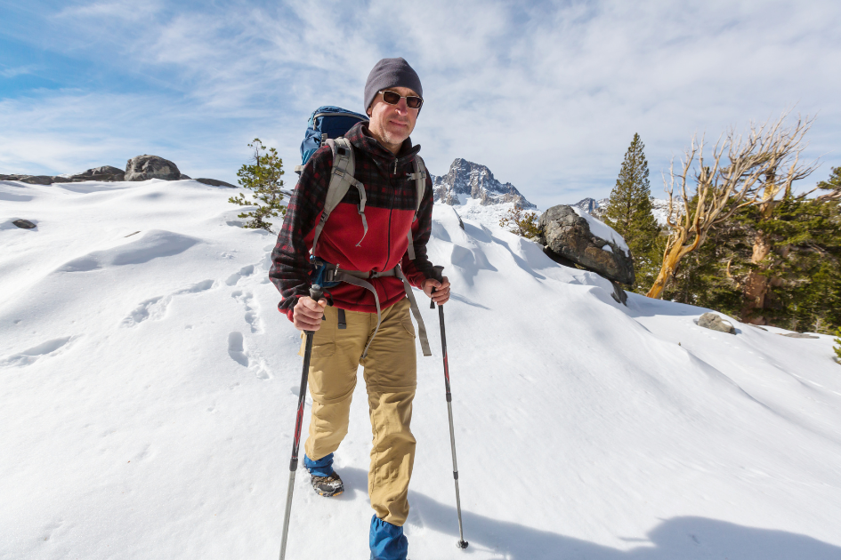 man hiking in winter